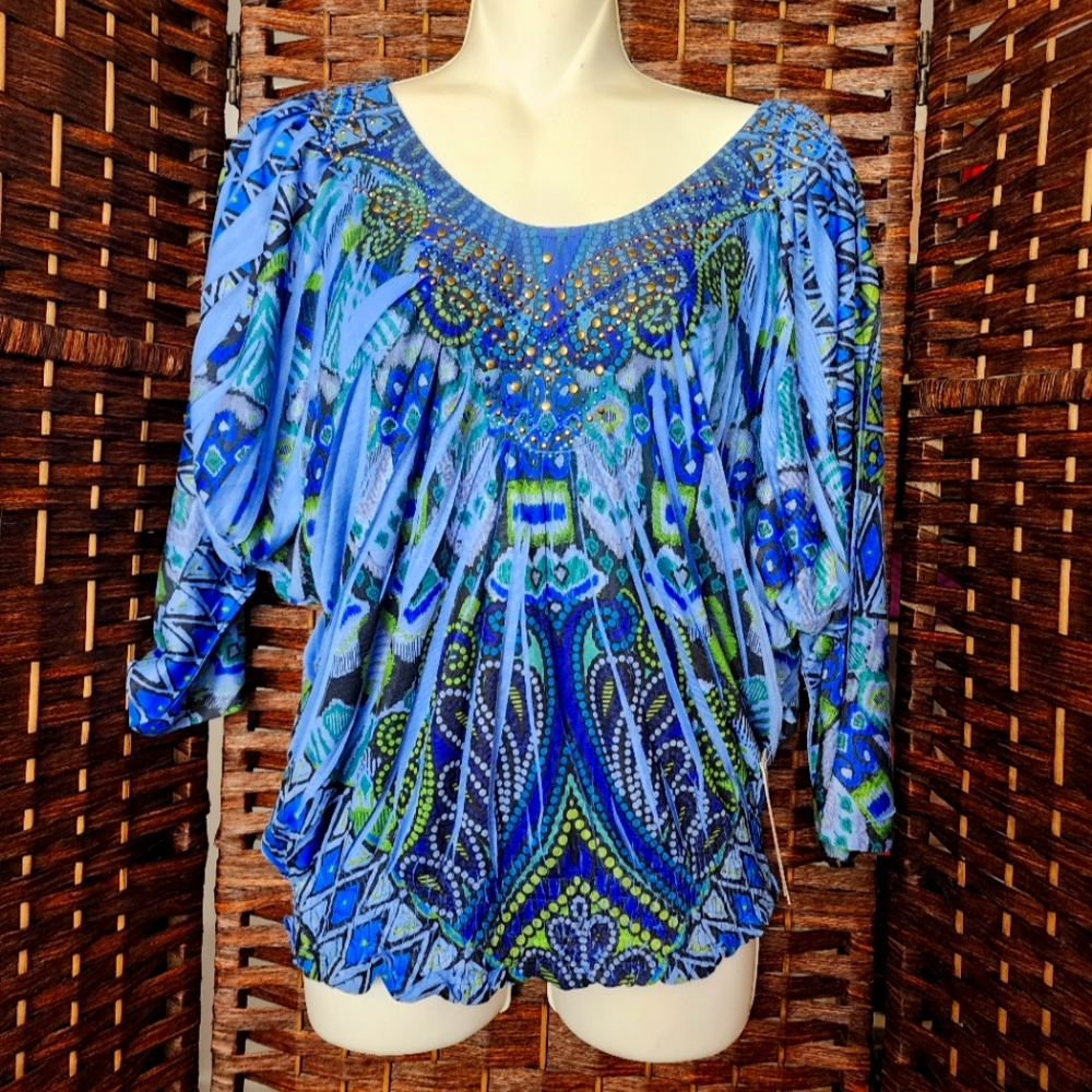 New Blue blouse with stones on the chest, 3/4 sleeves. It is beautiful on the sl